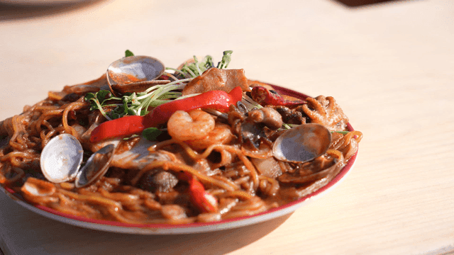 Plate of spicy stir-fried eafood noodles