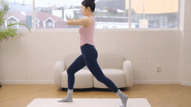 Woman practicing yoga indoors