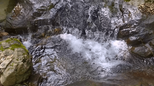 Small waterfall flowing over rocks