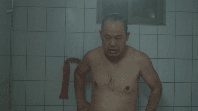 Man showering in bathroom