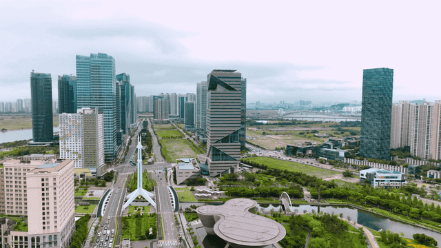 Modern cityscape with skyscrapers and greenery