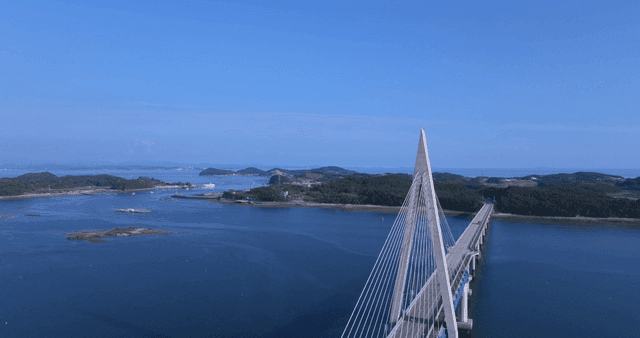 Long bridge stretching over calm sea