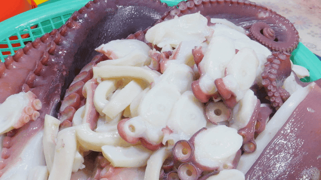 Freshly sliced octopus on a tray