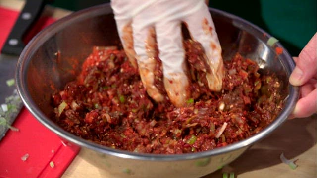 Mixing raw pollack seasoning with red pepper powder