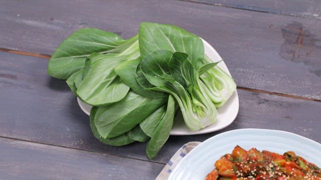 Korean boiled pork with bok choy kimchi on a plate