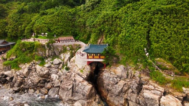 Traditional Korean temple on a coastal cliff