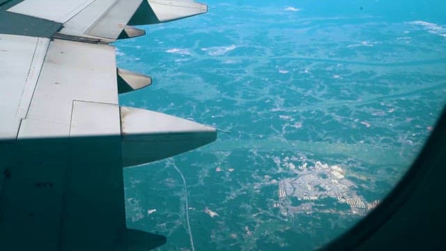 Aerial View from Airplane Window Over Landscape