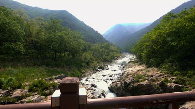 Fast flowing valley with mountains on both sides