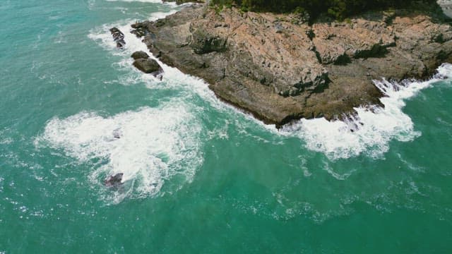 Waves crashing against rocky cliffs