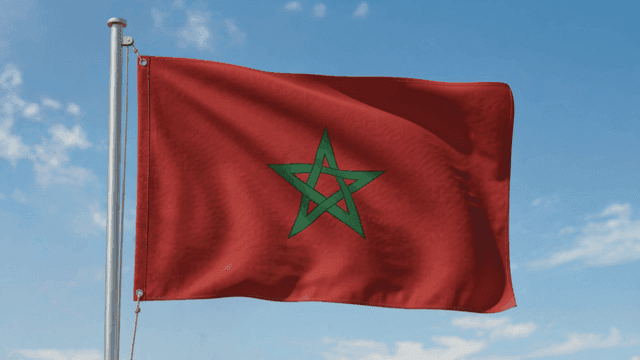 Red Moroccan flag with green star.