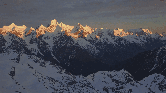 Snow-covered mountains at sunrise