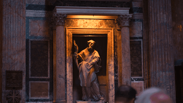Statue in a dimly lit historical building