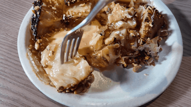 Grilled cabbage with sauce and nuts