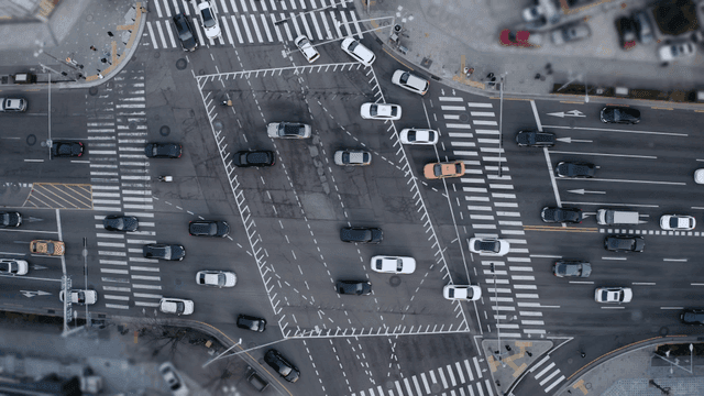 Busy city intersection with moving cars