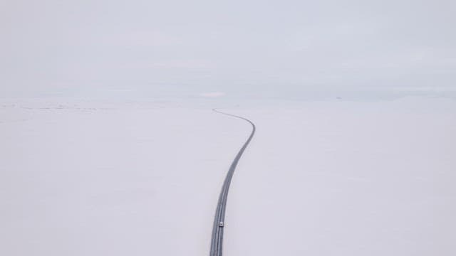 Car driving on a snowy road