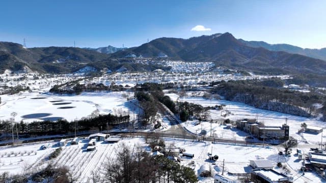 Winter Landscape with Snow-Covered Hills and Trees