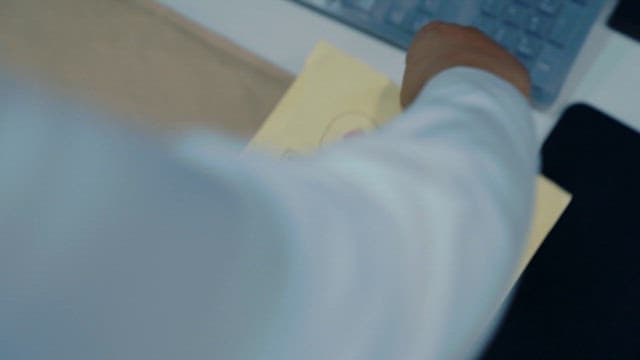 Person Taking out a Smartphone from a Document Bag