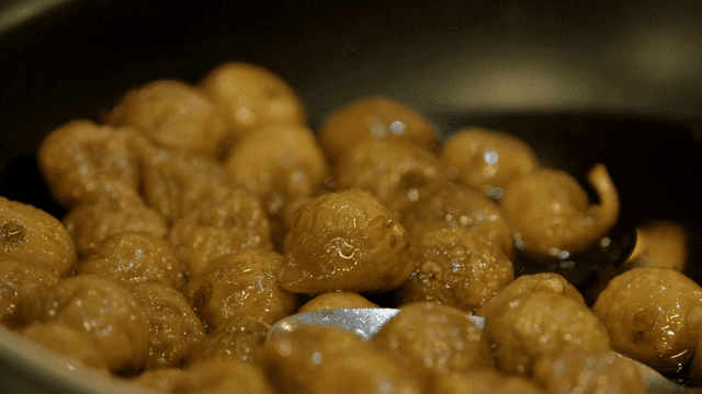 Glossy fig stew cooking in pan
