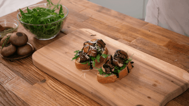 Sourdough topped with fresh vegetables and mushrooms
