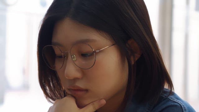 Woman deep in thought indoors