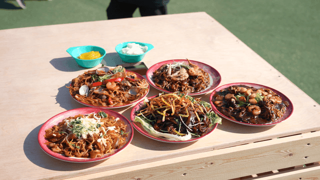Various jajangmyeon dishes on a table