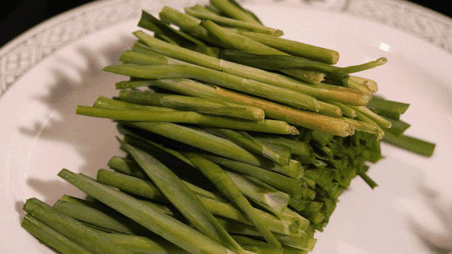 Fresh chives on white plate