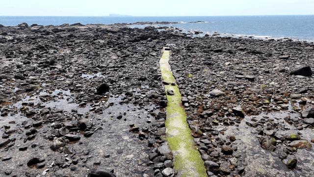 Rocky shoreline with a narrow path