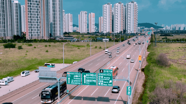 Busy highway with high-rise buildings.