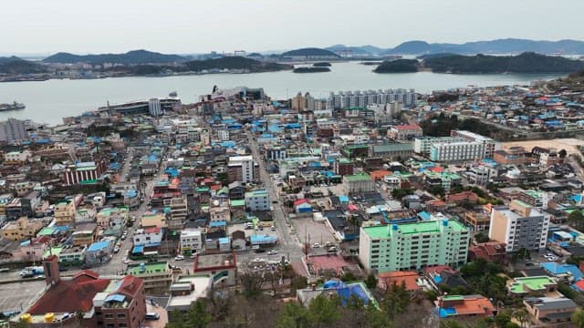 Vibrant coastal city with colorful rooftops