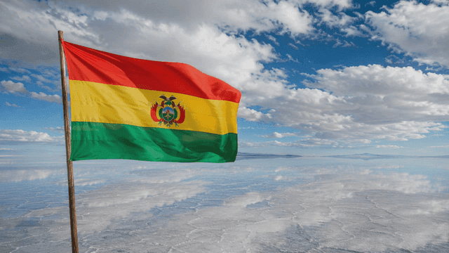 Bolivian flag waving over salt flats