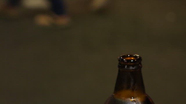 Pouring of Beer Into Glass