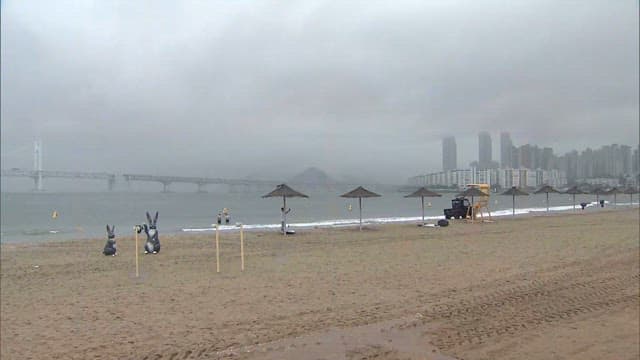 Gloomy Beach Day Amidst Urban Skyline