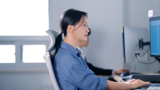 Woman working at a computer in an office