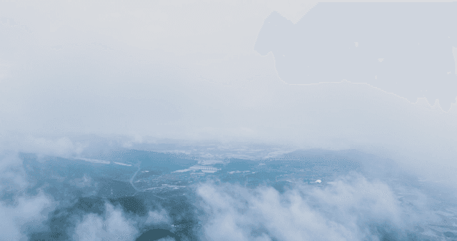 Clouds drifting over a mountain landscape
