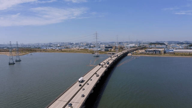 Bridge and cars over the blue river