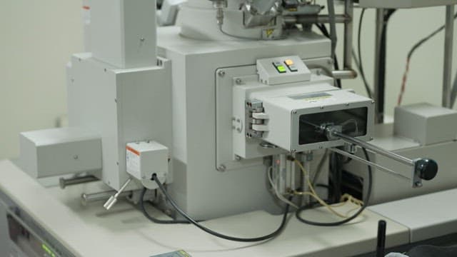 Close-up view of an industrial machine in a laboratory setting