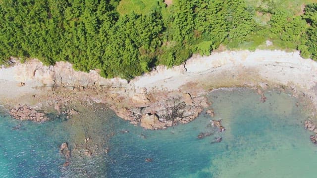 Coastal view with clear blue water