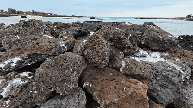 Rocky beach with piles of stones