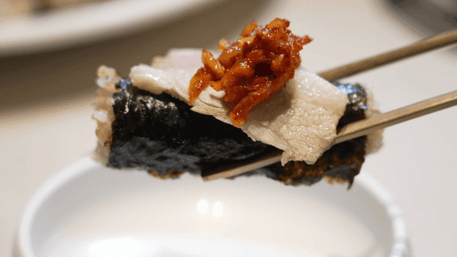 Korean boiled pork with kimchi on kimbap