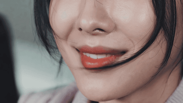 Smile of woman wearing red lipstick