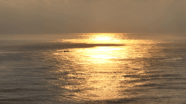 Golden sunset over a calm ocean