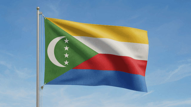 Comoros Federation flag fluttering under clear sky