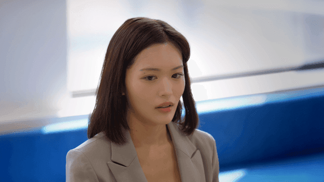 Female office worker in suit answering