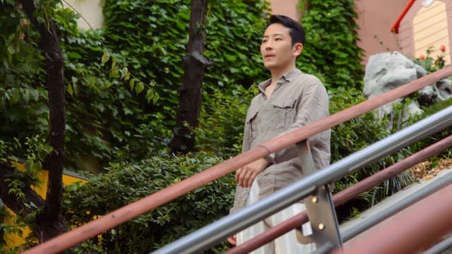 Man walking down outdoor stairs