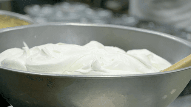 White whipping cream in large bowl