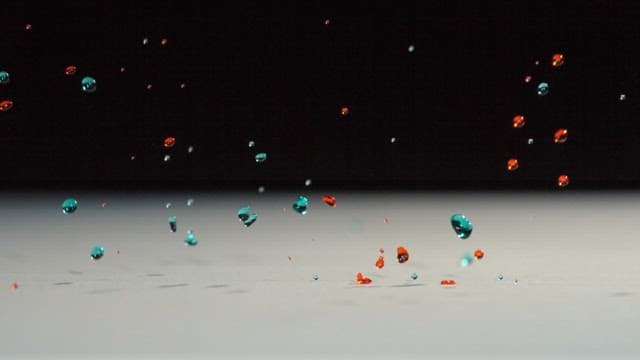 Water droplets bouncing on a smooth surface under dim lighting