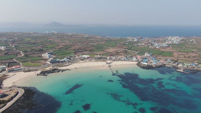 Coastal village with clear blue sea