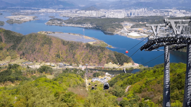 Cable cars over a scenic mountain landscape