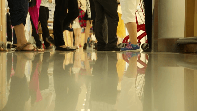 People walking in a busy shopping mall