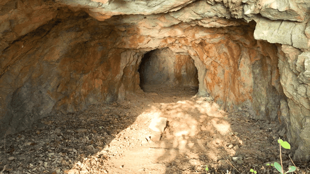 Rocky cave entrance with sunlight